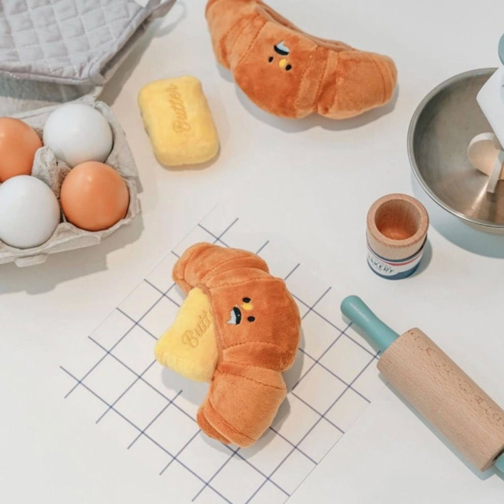
                      
                        Butter Treat Dispenser Dog Toy: Squeak & Crinkle Fun
                      
                    
